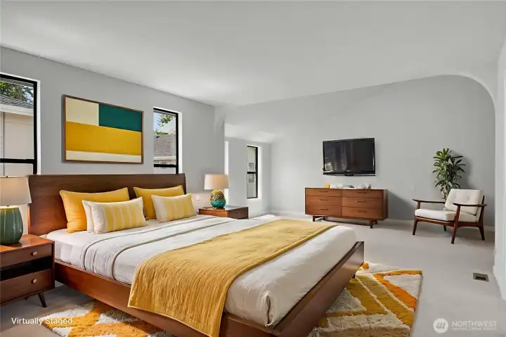 Step into the expansive primary bedroom—spacious enough to accommodate a private sitting area. Virtually staged.