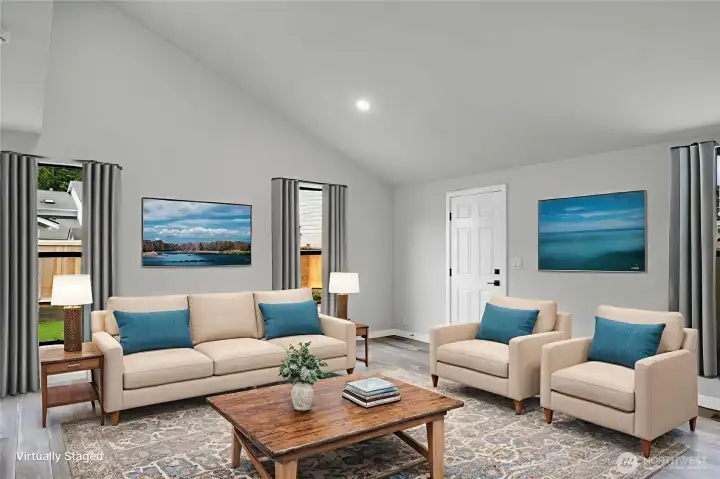 Vaulted ceilings and abundant windows fill this spacious ADU with natural light. Virtually staged.