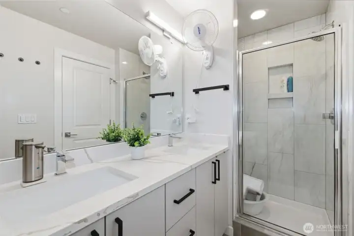 Third Level: Primary 3/4 bath with his & her sink