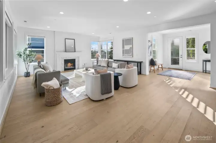 Sun-soaked great room with cozy gas fire place