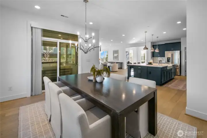 Dining room opens to the outdoor kitchen making summer BBQs simple