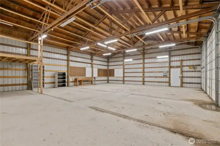 Two pedestrian doors with small lofted area at rear of space.