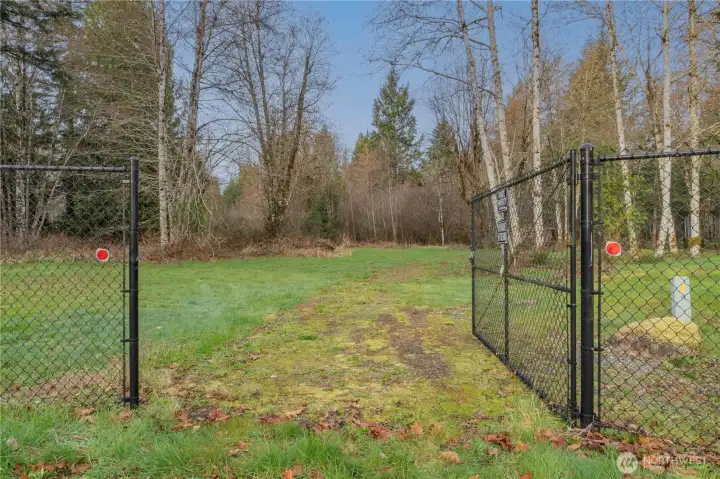 Enter the gate to the park like setting.