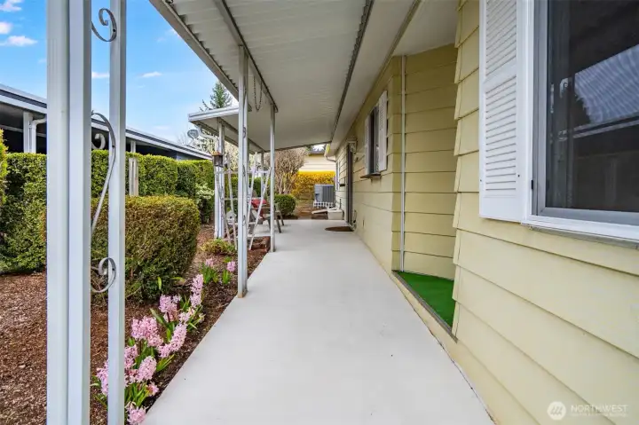 Stroll up the flower lined path to the front entry!