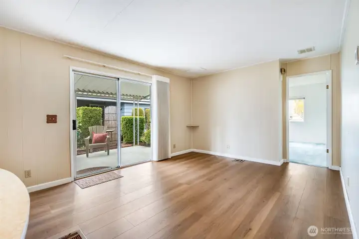 Wonderful natural light comes through the sliding door on to the newer LVP flooring.