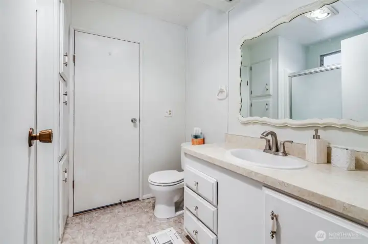 This 3/4 bathroom can be accessed through the laundry room or the second bedroom.