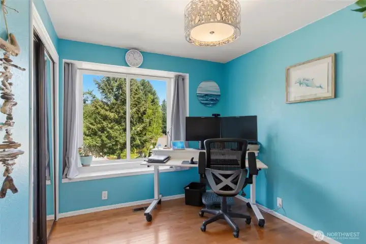 Bedroom 2 across from primary suite.