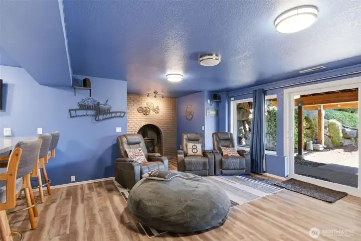 Ultra cool media room or flex space! Bedroom, wet bar, fireplace and outside access.