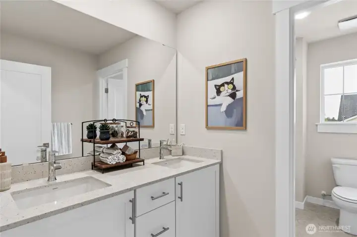 Second floor guest bath with tub/shower combo and quartz counters