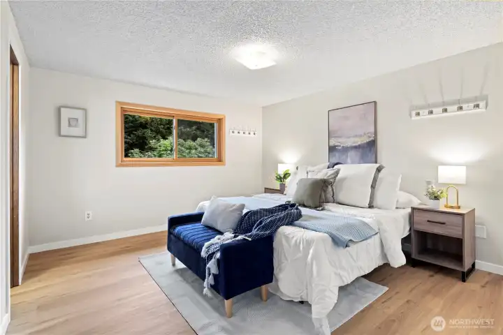Large primary bedroom with walk-in closet and full bath
