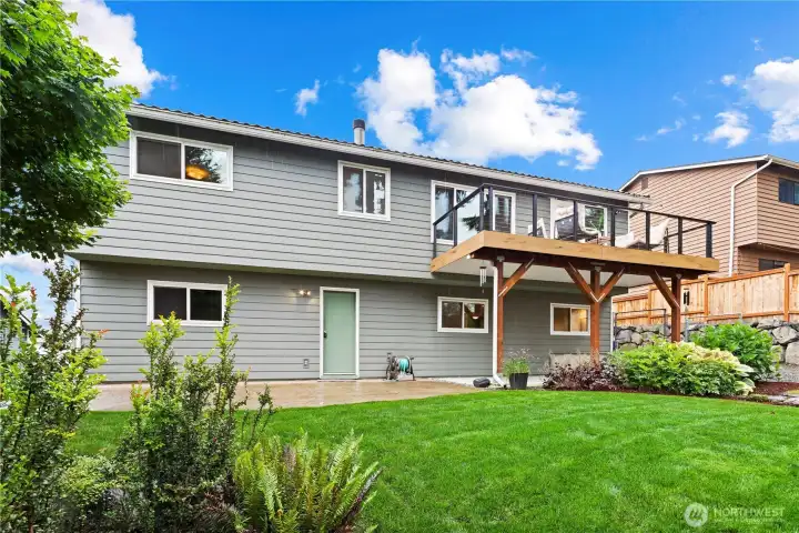 Professionally landscaped, easy-to-maintain grounds showcase native and climate-appropriate plantings, along with a thoughtfully designed rain garden.