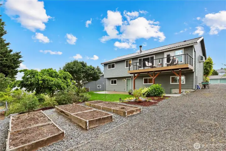 Secondary driveway provides backyard access and flexible parking options, including space for a small RV, boat, or additional vehicles.