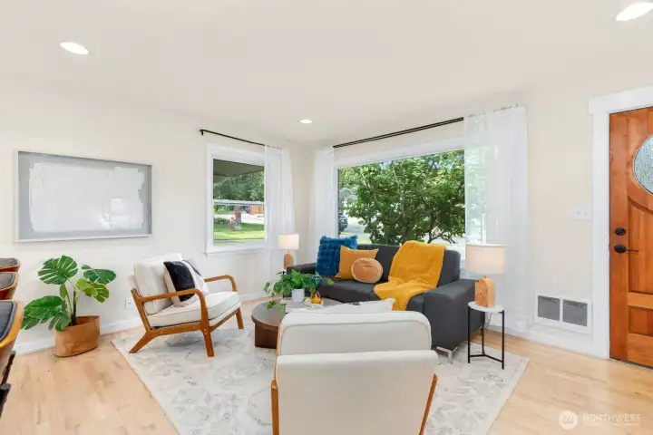 Large windows flood the room with natural light.
