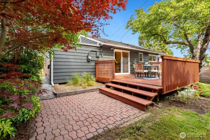 Paved patio space for additional outside functionality.