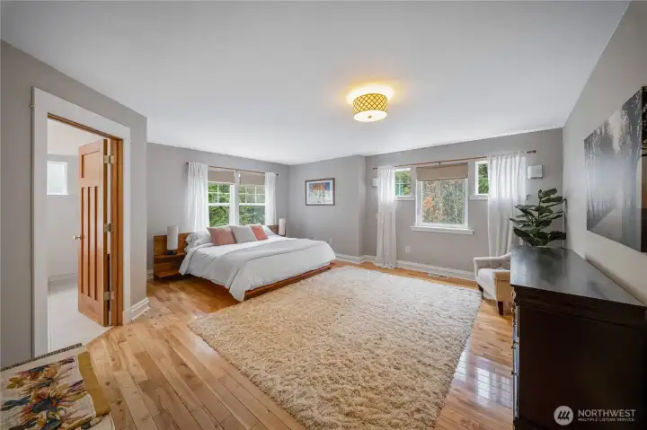 Wow! This oversized primary suite has room to spare! Beautiful Birch floors and lots of light in this airy room. Wow! This oversized primary suite has room to spare! Beautiful Birch floors and lots of light in this airy room.