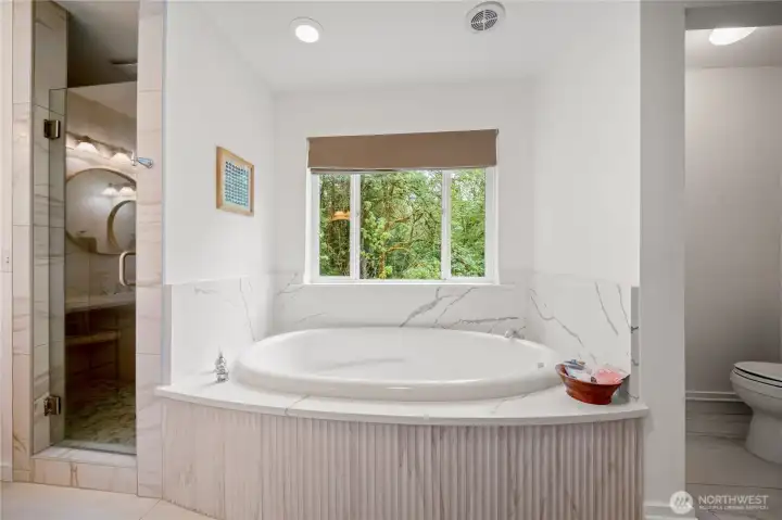 Large soaking tub and walk in shower with handsome, modern finishes Large soaking tub and walk in shower with handsome, modern finishes