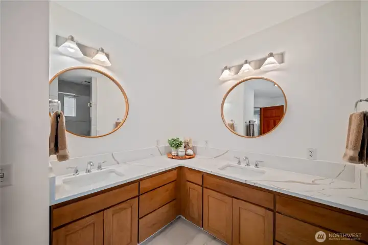 Clever, split double vanities with plenty of counter and cabinet space Clever, split double vanities with plenty of counter and cabinet space