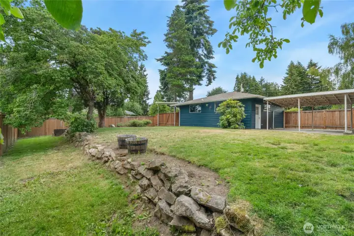 Backyard and view of detached garage