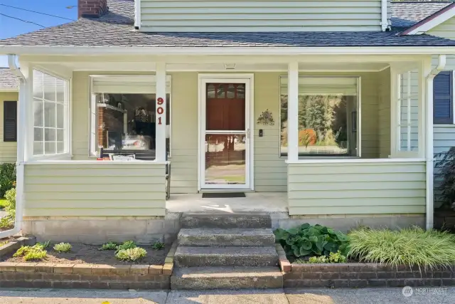 Cozy covered front porch for sipping morning brew