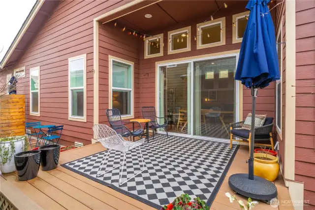 The large slider leads to an oversized Trex deck which expands the living space.  Very private outdoor living! SW exposure so fantastic orientation.