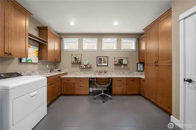 The popular Smart Space offers the perfect space for a workspace, crafting or hobbies!  Also the laundry/mud room with an undermount utility sink.  The washer and dryer which stay with the home.  Tons of storage space as well.