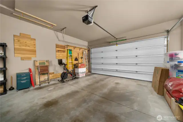 Fully finished two car garage with neat storage solutions.