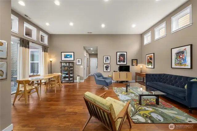 Large great room with gorgeous Engineered hardwoods, tall ceilings and tons of natural light.