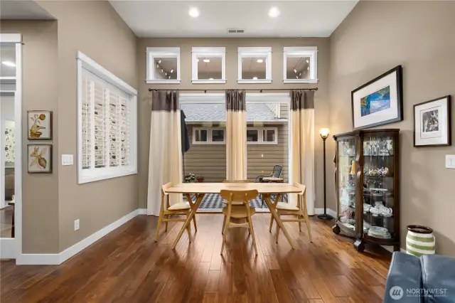 Spacious dining bathed in light.  This homes property goes to the side of the neighboring home.  The windows of that house are over 7' up so totally private!