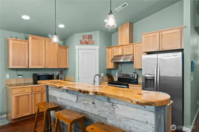 This kitchen is perfect for entertaining, it overlooks the eating area and living area and easy access to slider for access to the back deck.