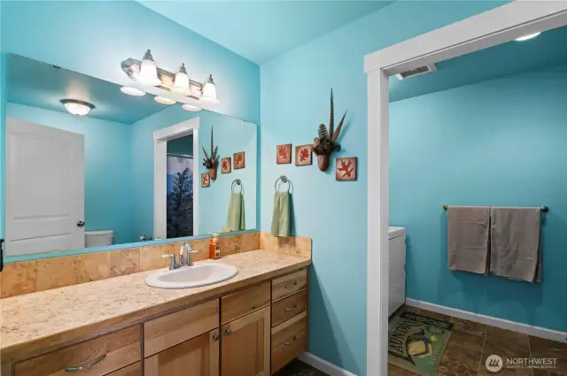 Guest bathroom that joins the laundry room.