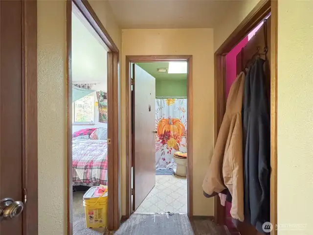 Upstairs hall with full bath, linen closet and two bedrooms.