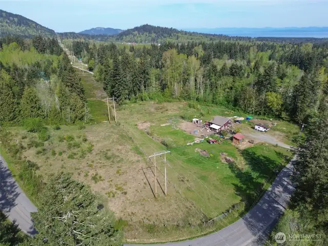 Another aerial view of the property. Fence line on the left part of fenced pasture for livestock.