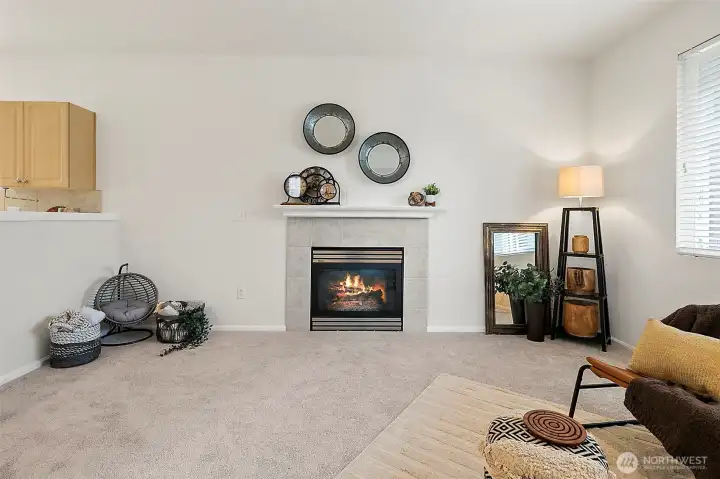 Cozy gas fireplace with an open floor plan feel.