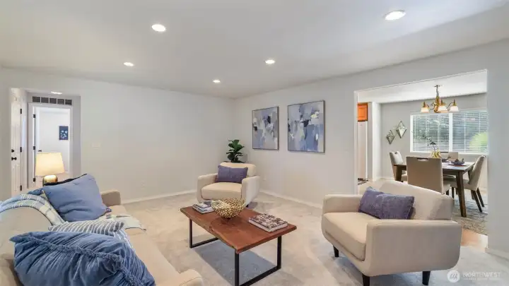 The open layout connects the sitting room to the dining space with ease.