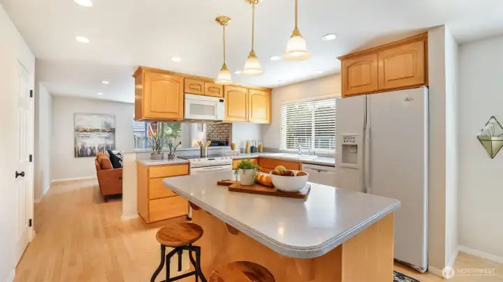 Functional island adds versatility for cooking, dining, or gathering.