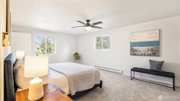 Relax and unwind in this serene primary suite.