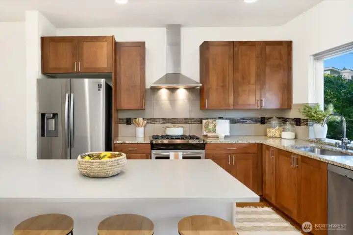 Contemporary Kitchen with large kitchen island and sparkling stainless steel appliances!