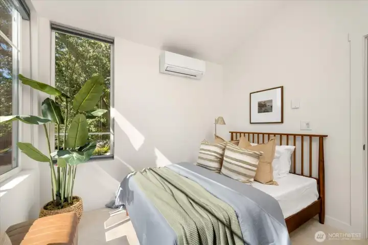 Green views from this bedroom make it dreamy!