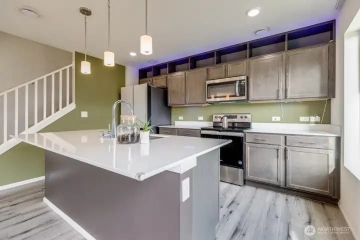 Open concept kitchen with quartz countertops