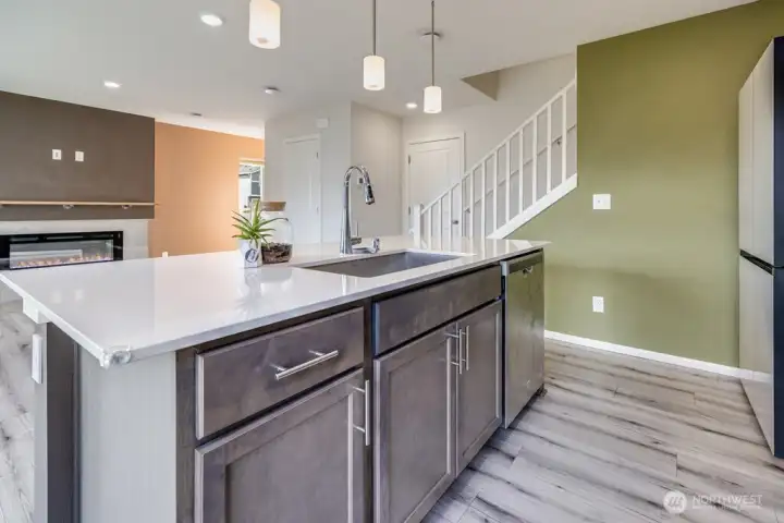 Kitchen looks out to living room