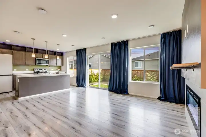 Kitchen has sliding door to backyard