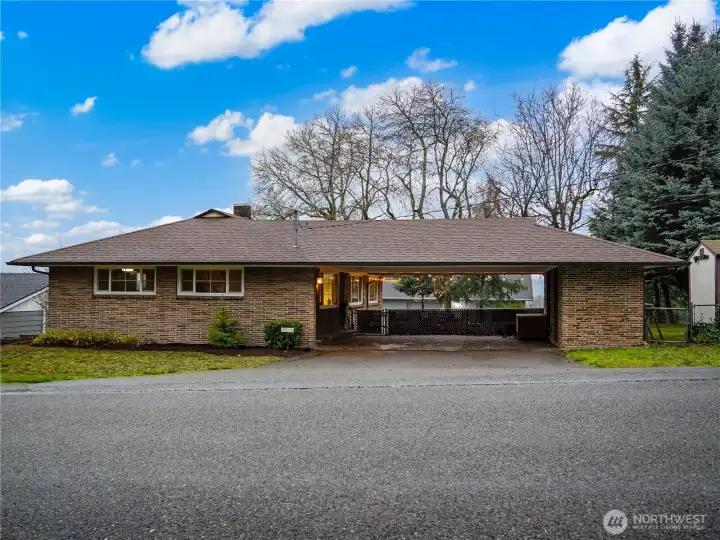 The connected carport allows for two vehicle to park under cover.