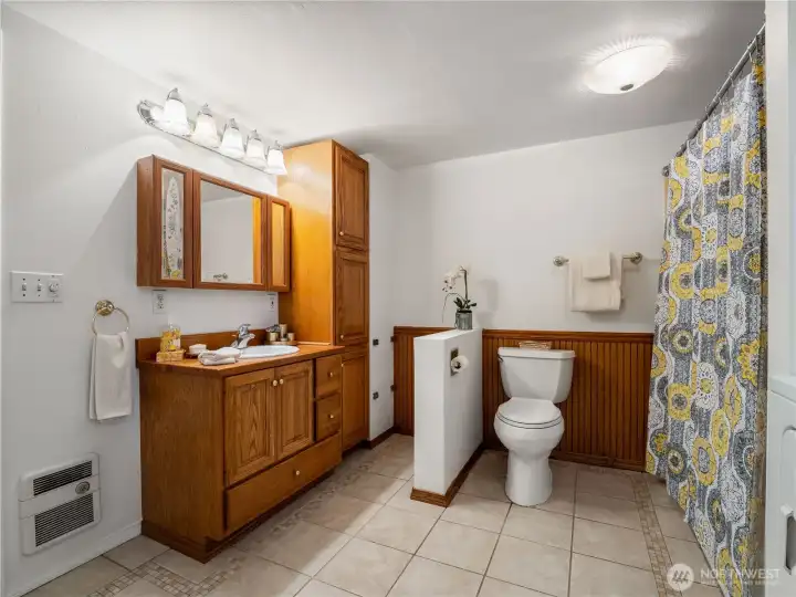 You have room to store your knick knacks and in this well planned out bathroom.