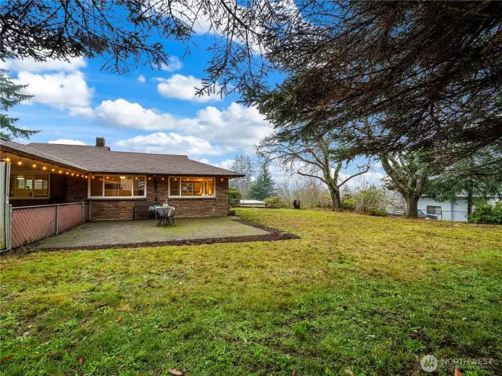 Mature trees are framing the yard and give shade on those hot summer days.