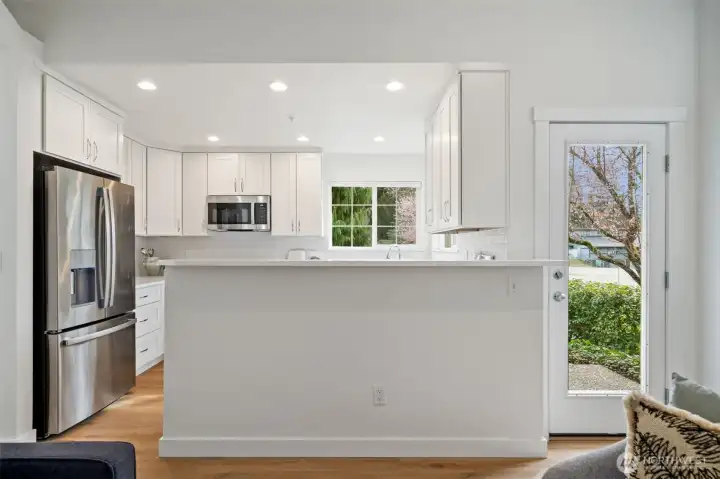 Breakfast bar with brand new quartz counters, all new appliances, electrical and new soft close cabinets!