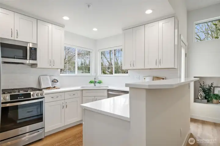 Fresh 'to the studs' kitchen - quality choices in cabinets, counters, appliances & tile.