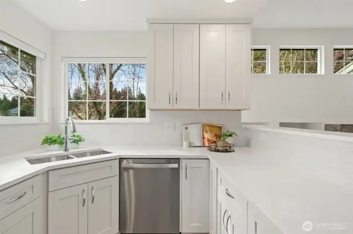 Storage, function and all right off the rec room with tall ceilings and great high windows for natural light.