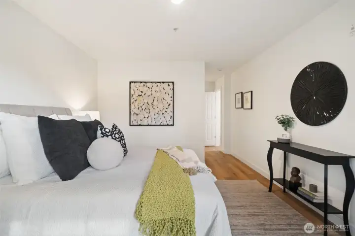 Primary on main looking toward the en-suite bathroom & walk in closet.