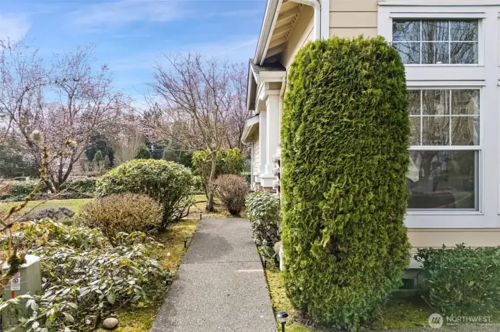 Entry to the home - nice end unit with open space & mature grounds.