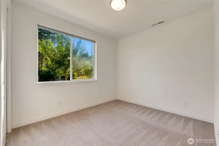 Main level bedroom with closet